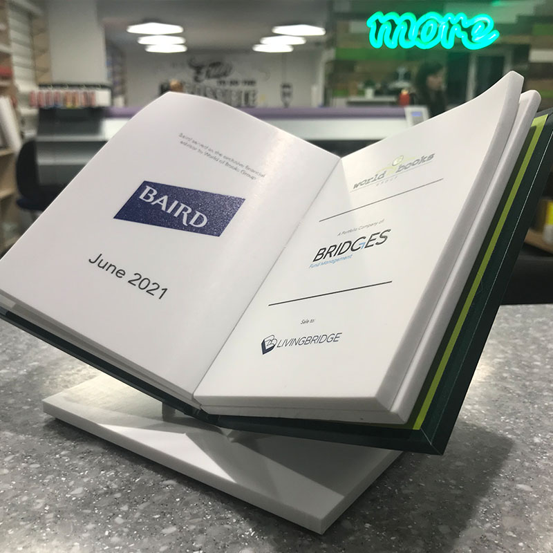 Open book corporate award made from Eco Stone with printed page details – branded plinth presentation piece