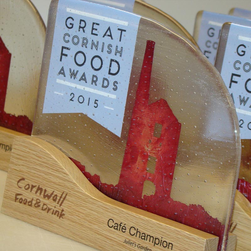 Great Cornish Food Award trophy – kiln-fired glass with red copper detail and oak base featuring Cornish engine house