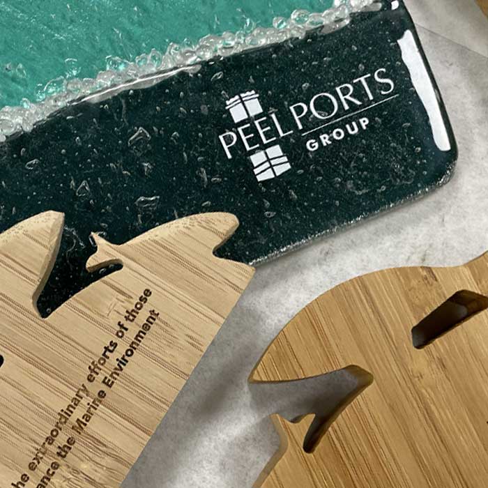Recycled glass awards for Peel Ports Group in teal green and bamboo | More Awards