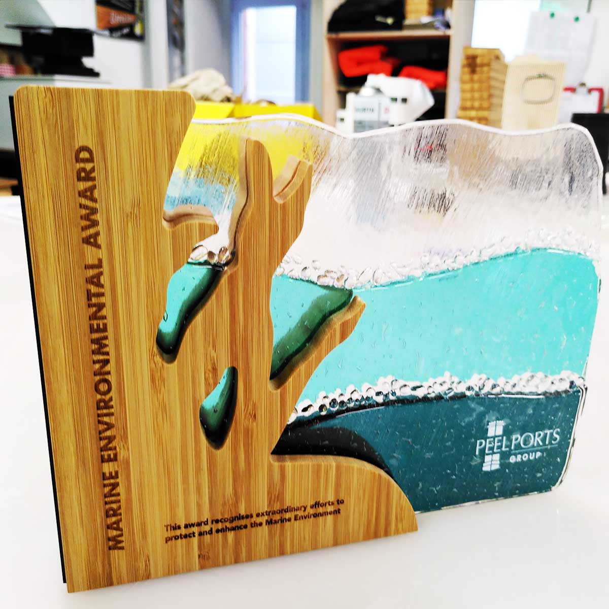 Marine Environmental Award for Peel Ports Group made with bamboo and fused recycled glass layers – ocean-inspired sustainable trophy