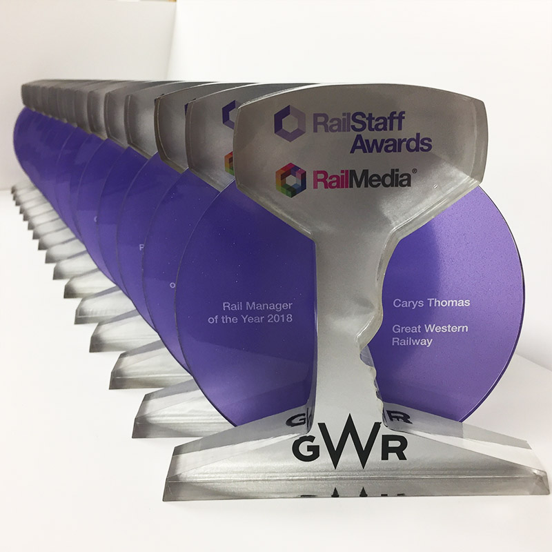 RailStaff Awards trophies for Rail Media – custom frosted acrylic awards with purple circular detail and engraved categories
