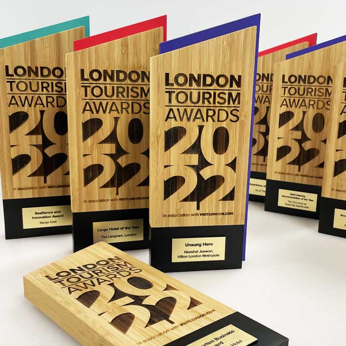 London Tourism Awards collection – precision-cut bamboo trophies with black engraved text and coloured sides