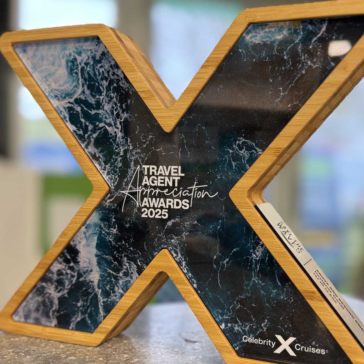 Celebrity Cruises Travel Agent Award in bamboo with marble-effect acrylic X inlay – bespoke partner recognition trophy