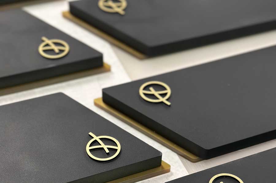 Eco Stone awards with gold inlay detail manufactured by More Awards