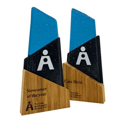 Striking recycled glass trophy with engraved bamboo plinth, crafted with care.