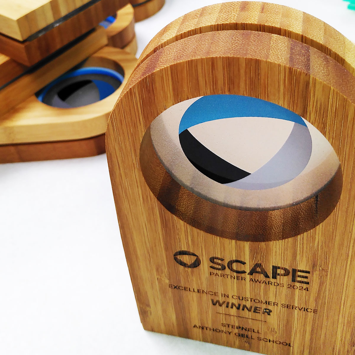 Handcrafted bamboo trophy with circular acrylic centre panel, designed by More Awards for modern sustainable award presentations