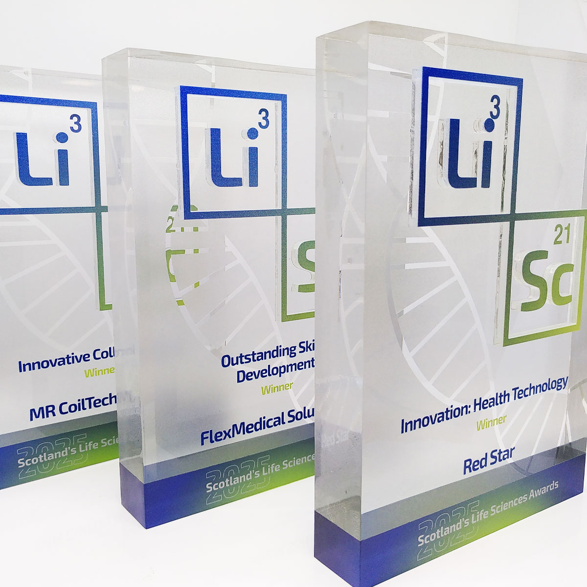 reestanding clear acrylic award with vibrant branding, made by More Awards for product launches and branded events