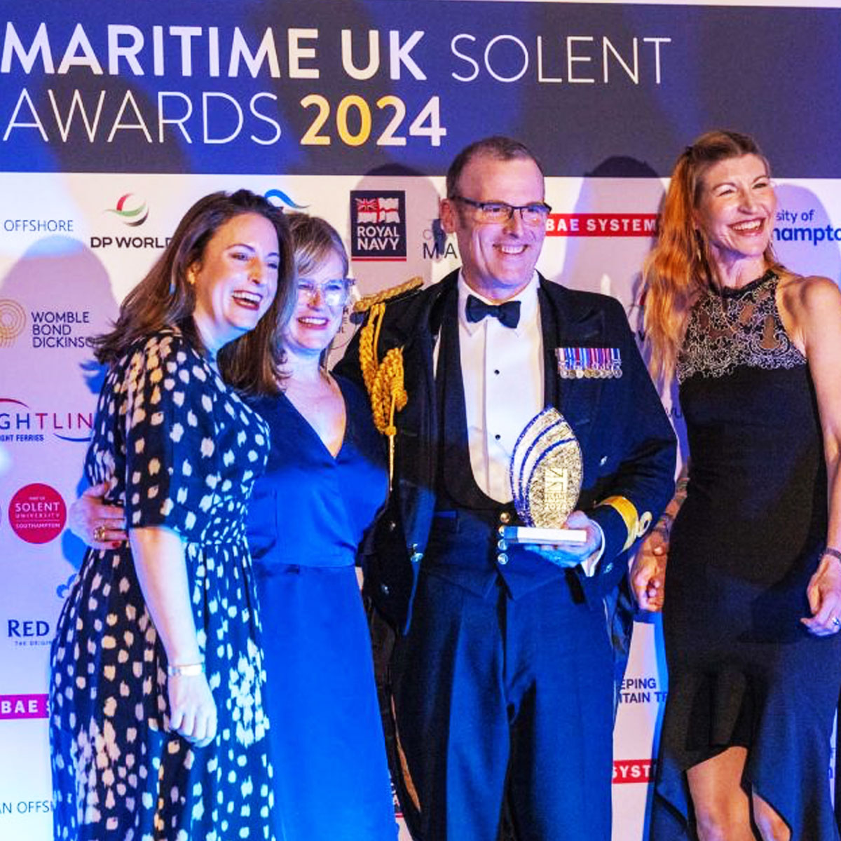 Recipients receiving the quality Caradoc Award made from recycled glass  | by More Awards