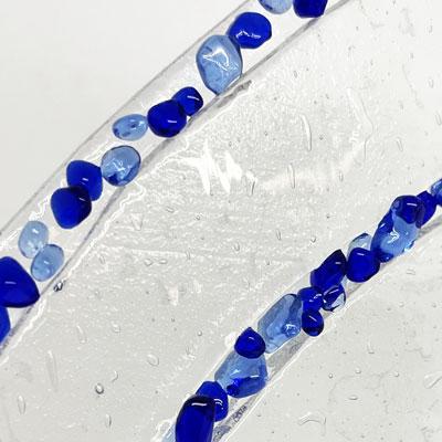 Textured glass trophy detail in blue with recycled acrylic support base by More Awards