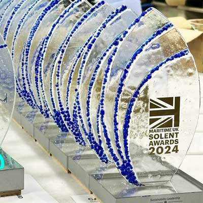 Blue glass-topped award with low-impact acrylic base ready for Maritime awards evening