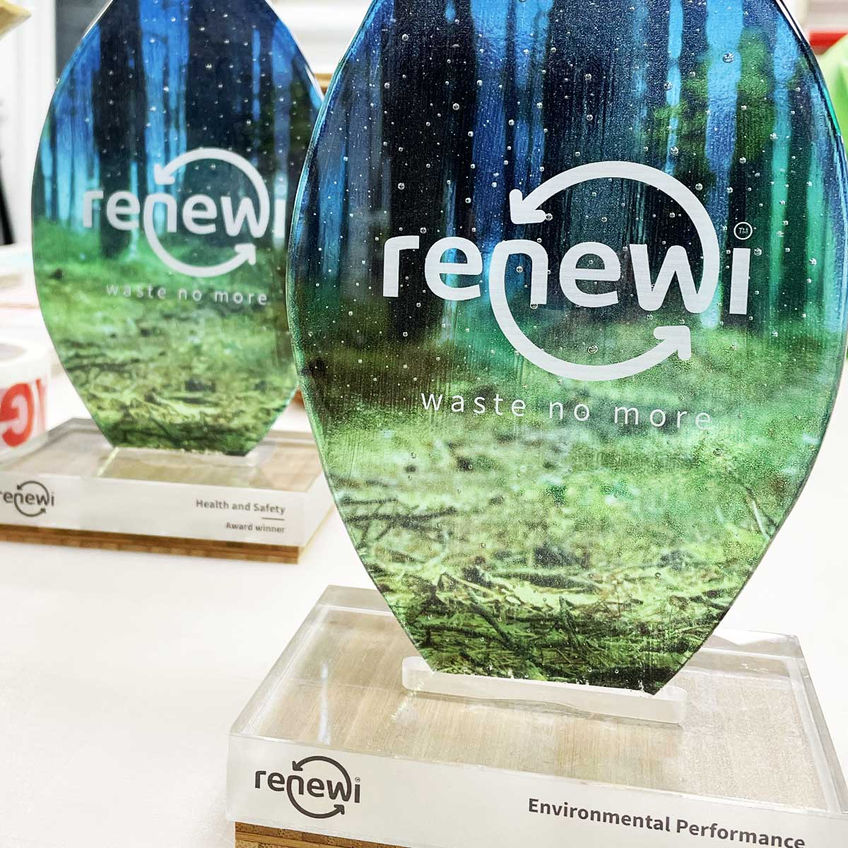 Kiln-fired glass award with a minimalist recycled acrylic base, produced by More Awards for CSR and environmental responsibility recognition
