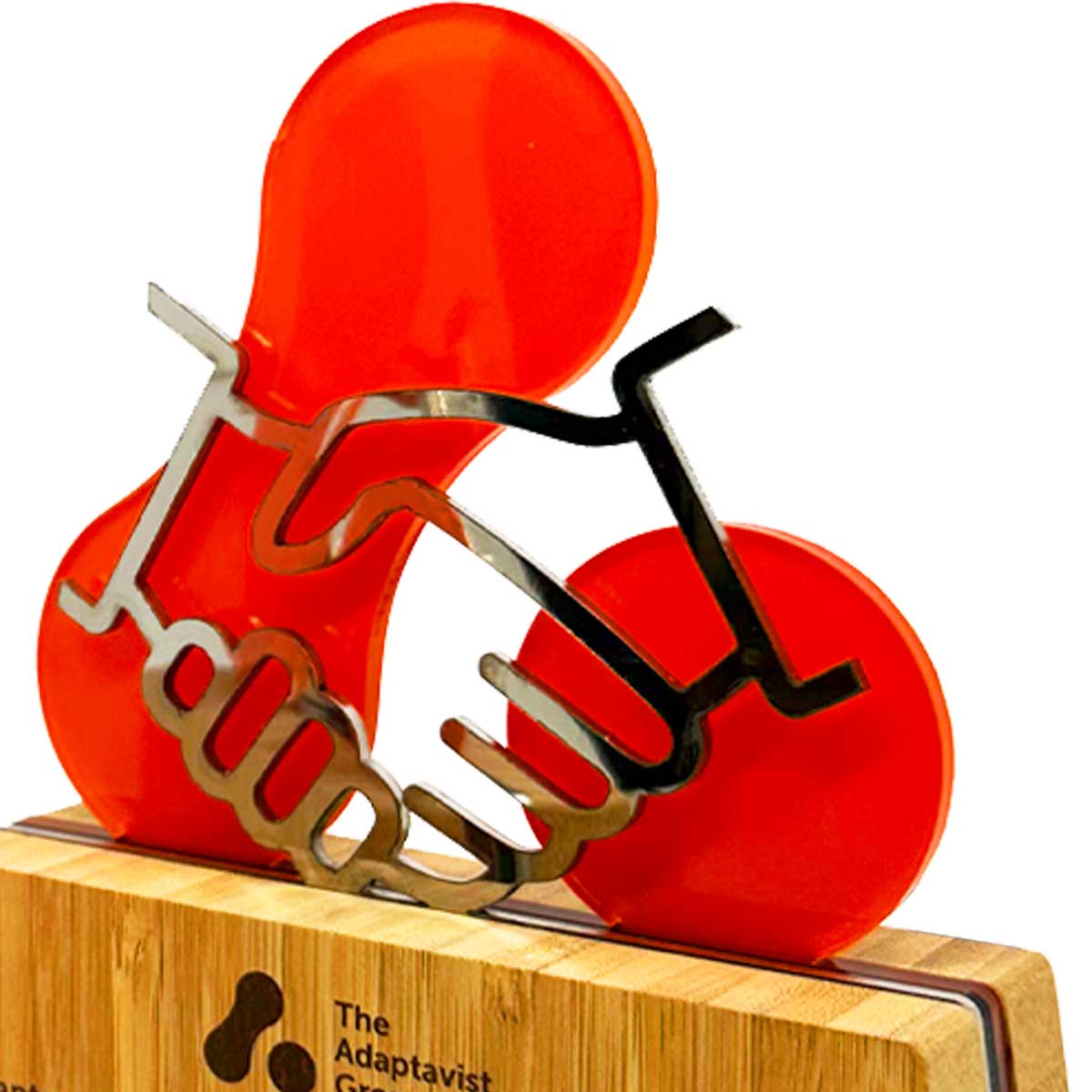Bamboo trophy featuring a stainless steel hand shake laser-cut panel with logo, produced by More Awards for sustainable corporate events and achievement recognition