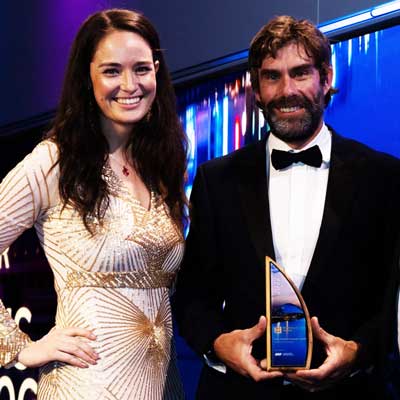 Proud winner holding the eco-friendly Elowen award