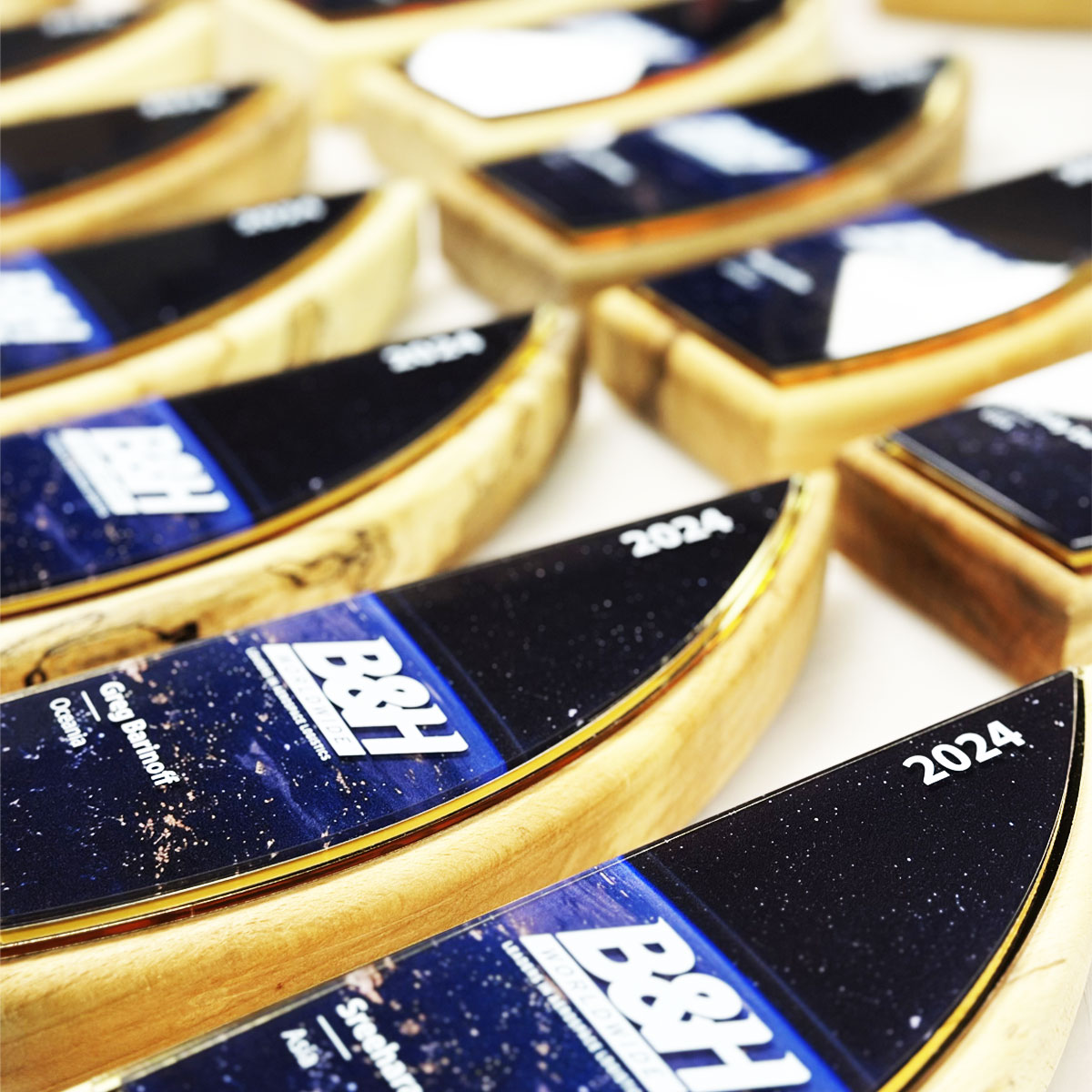 Maritime-inspired sail-shaped award crafted by More Awards from eco-friendly timber and recycled gold acrylic for nautical or ocean-related recognition