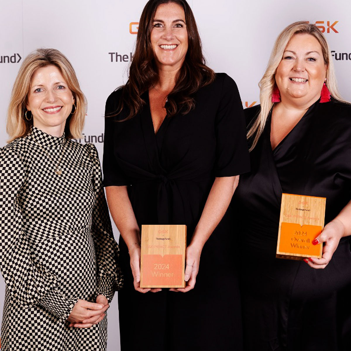 Award presentation featuring a printed Eseld wooden trophy by More Awards at a corporate or institutional event