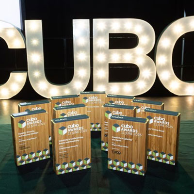 Academic award ceremony with printed wooden trophies on display