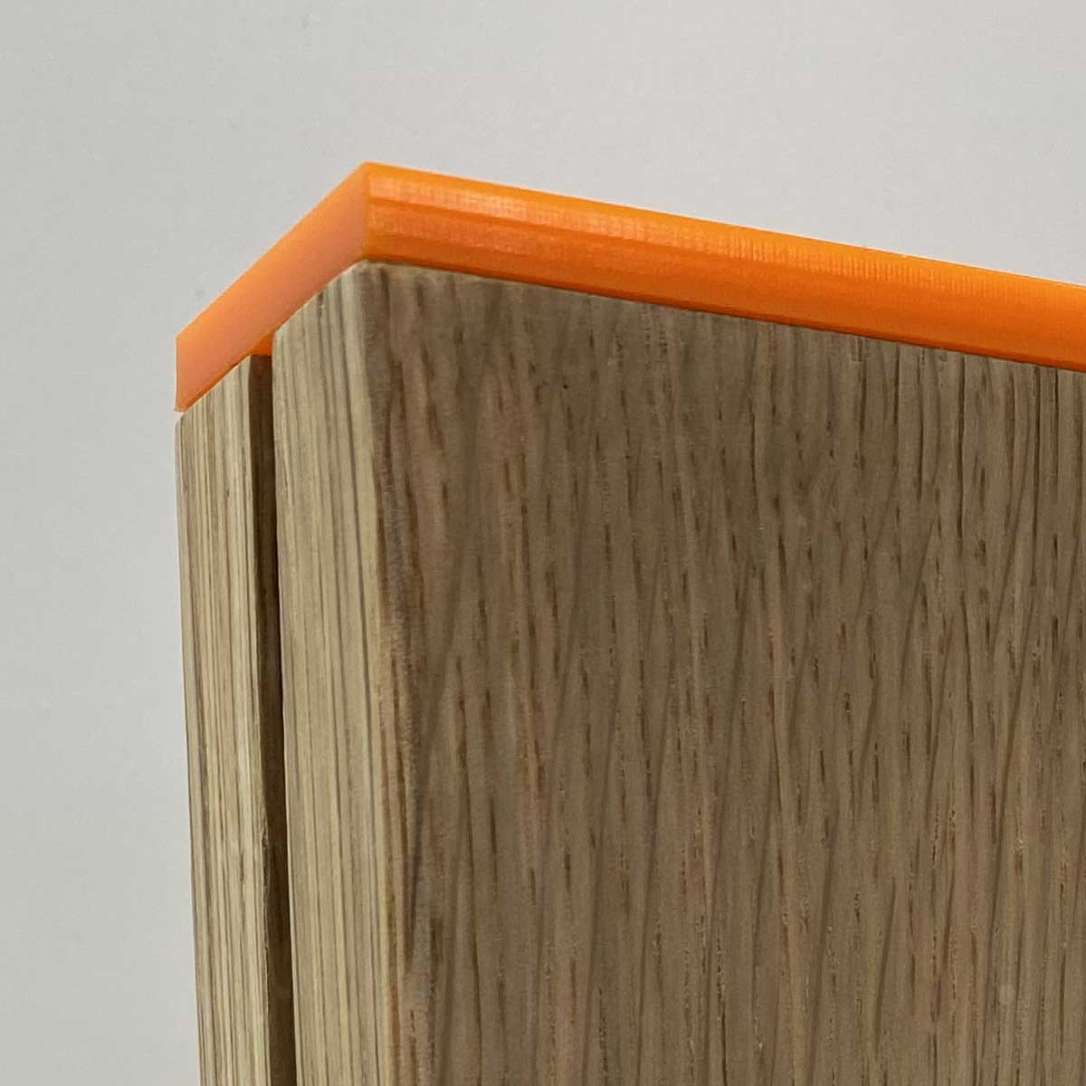 Sustainable layered wood award in oak with orange acrylic, made by More Awards for eco-conscious recognition ceremonies and branded events