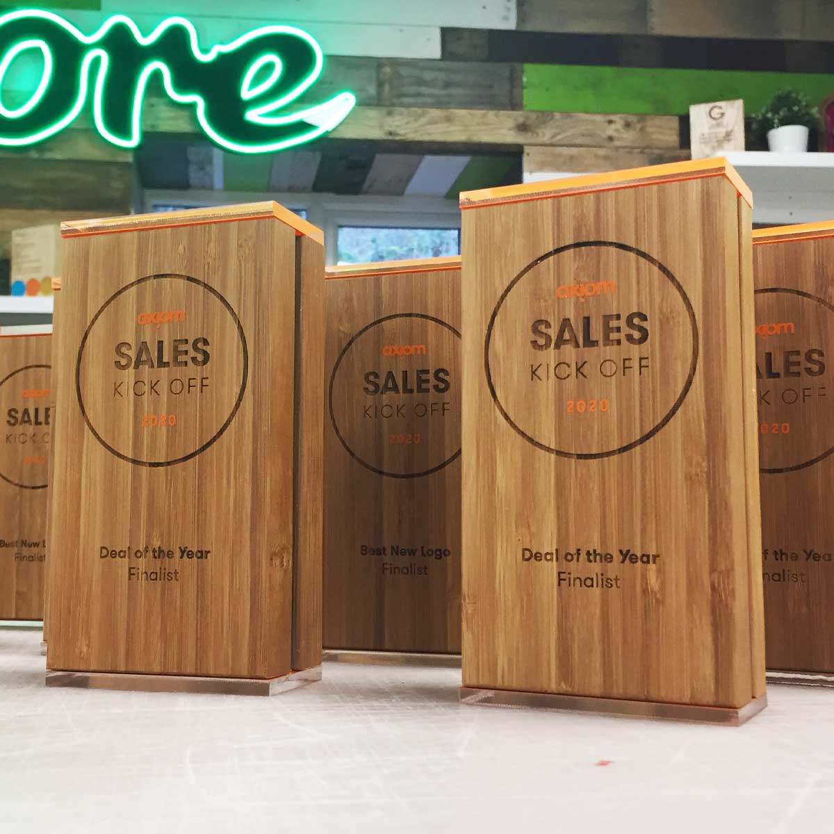 Bamboo double-layer award with engraved detail, handcrafted by More Awards for eco awards, education recognition, and business events