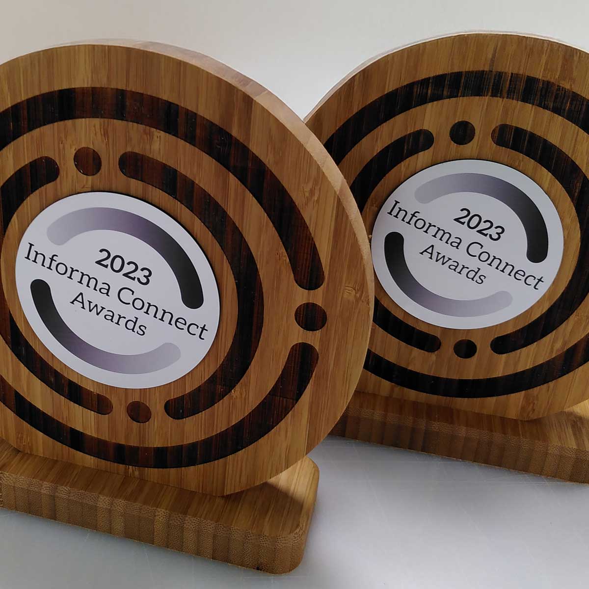 Circular bamboo plaque on stand, created by More Awards for eco awards, school ceremonies, and corporate recognition events