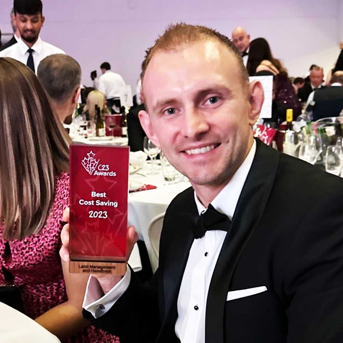Recipient accepting the Jago Award made from recycled acrylic| by More Awards