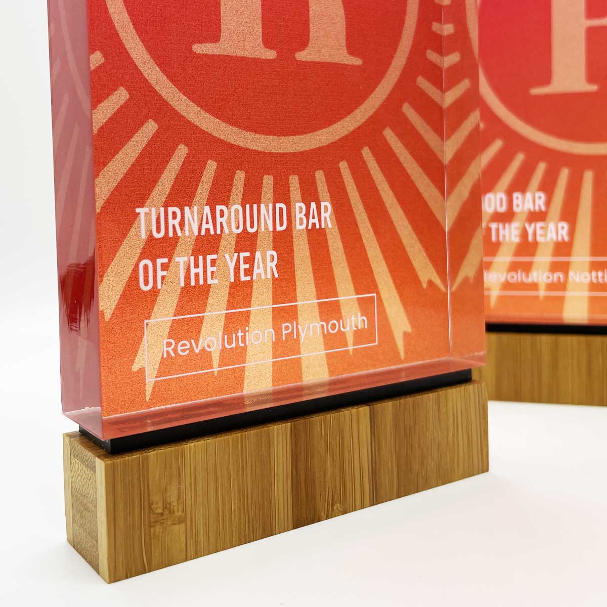Jago clear acrylic award with sustainable bamboo base, created by More Awards for sports clubs, athletic competitions, and leisure event recognition