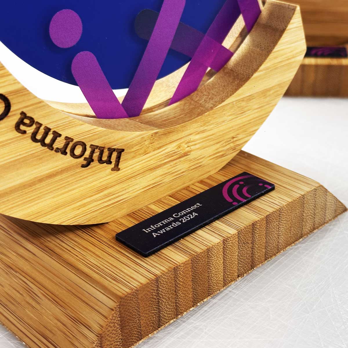 Eco bamboo trophy with printed centre disc, created by More Awards for environmental awards, green business initiatives, and innovation recognition