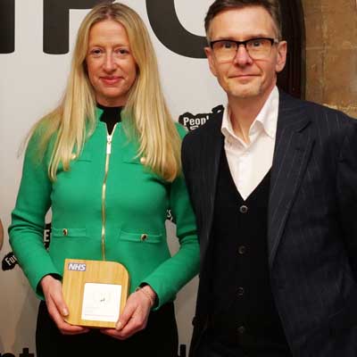 Healthcare professional receiving square award