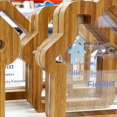 Morgelyn Awards with house shape design and custom logo print by More Awards