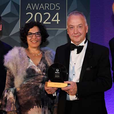 Circular black and gold award presentation event
