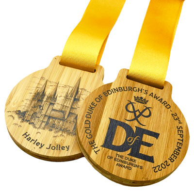 Royal event medals with ribbon detail to include laser and direct print finishes