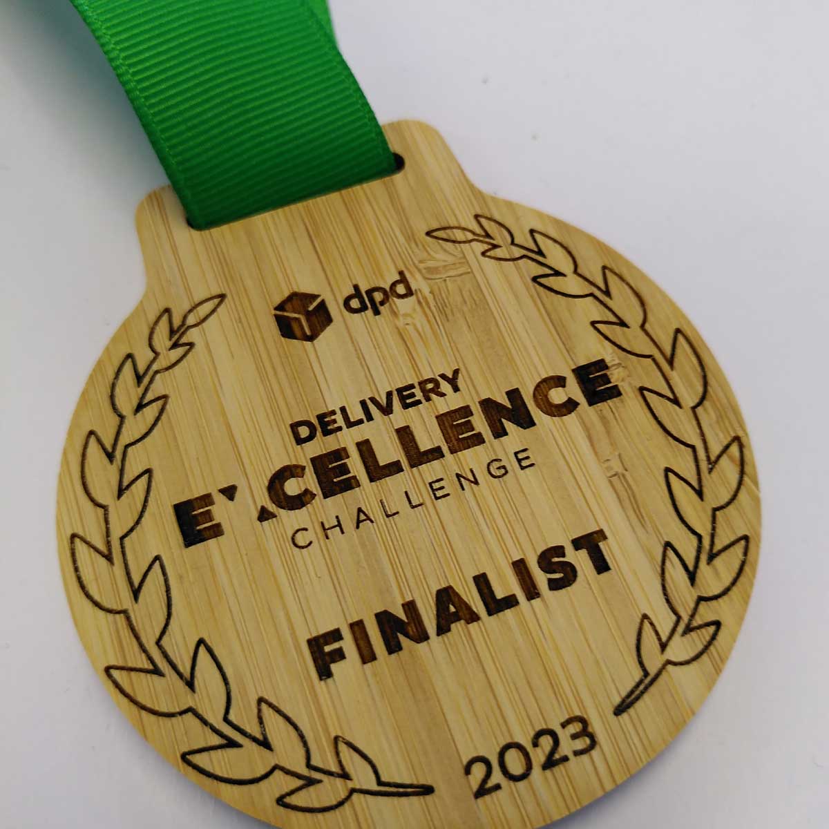 Award design blending natural textures – matte recycled glass meets polished bamboo | by More Awards
