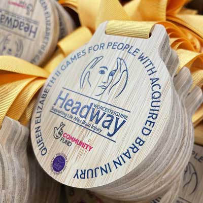 Peswara bamboo medals with yellow ribbon with direct printed face by More Awards