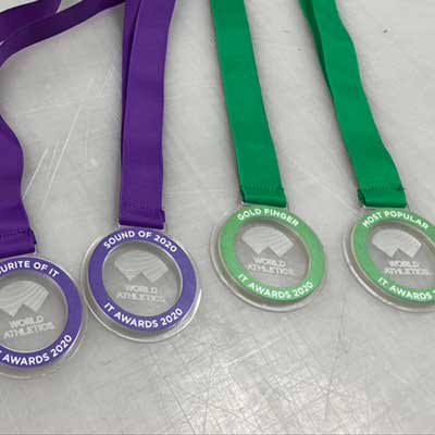 Sustainable medals with custom logo detail engraved or printed within circular design