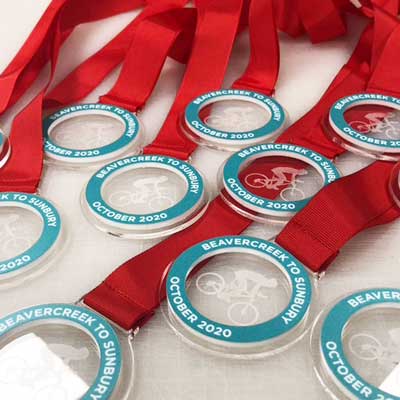 Brushed stainless steel affect detail on front of medals with ribon