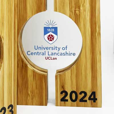 University logo detail on custom award ready for presentation.