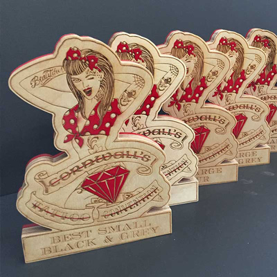 Sustainable tatoo convention awards with red diamond detail | by More Awards