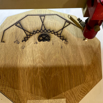 Lasering process of bespoke awards onto sustainable oak by More Awards