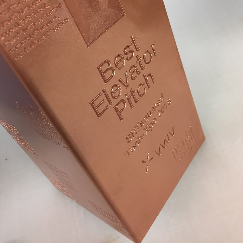 Solid recycled copper awards with engraved lettering detail | by More Awards